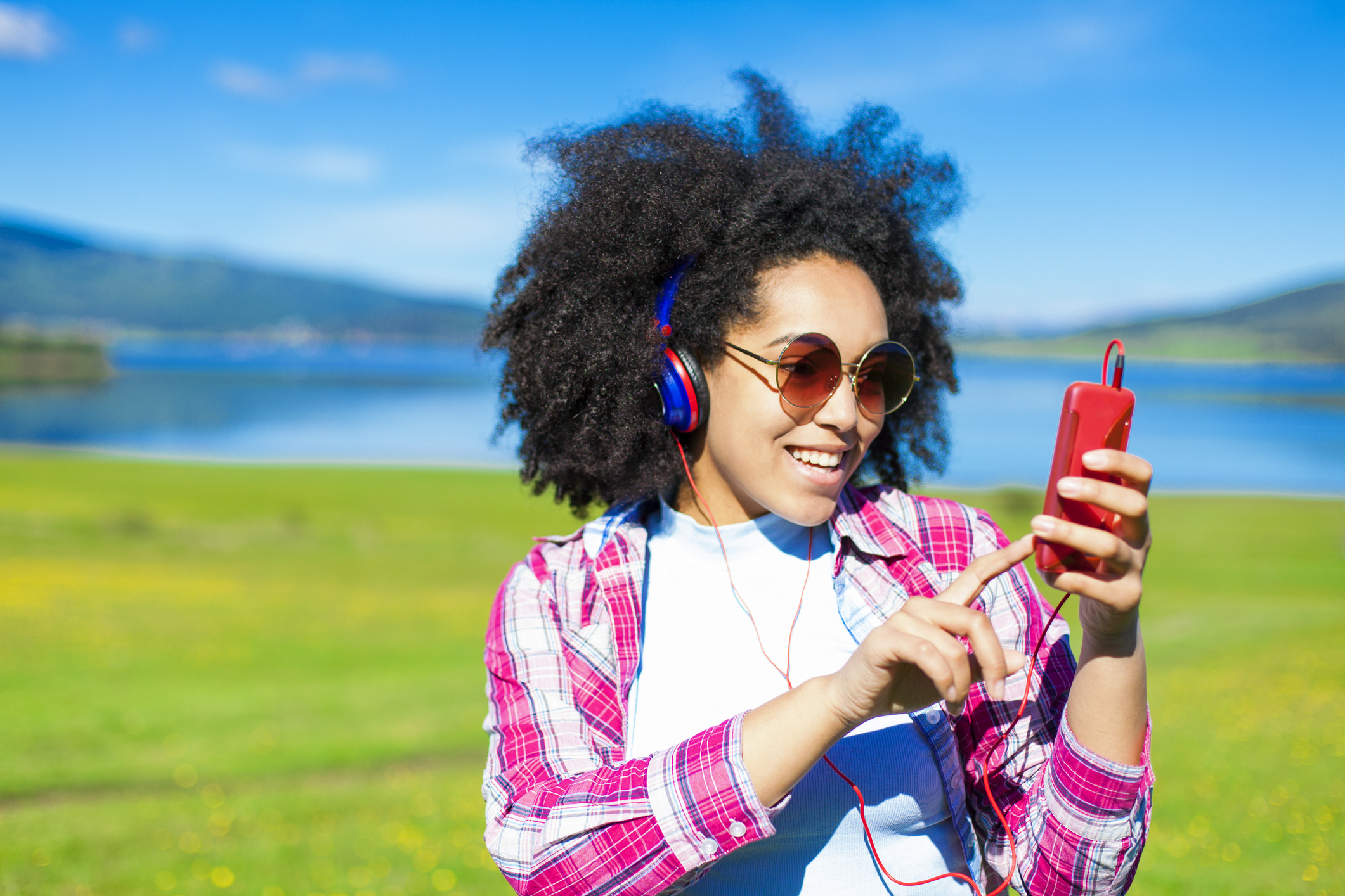 Woman listening to music in the nature.